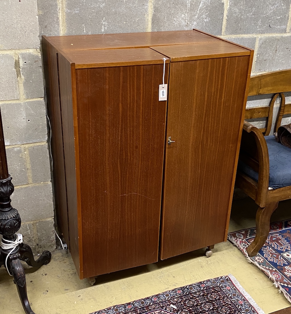 A mid century Newcraft Ltd. teak 'magic box' home office, width 84cm, depth 53cm, height 117cm